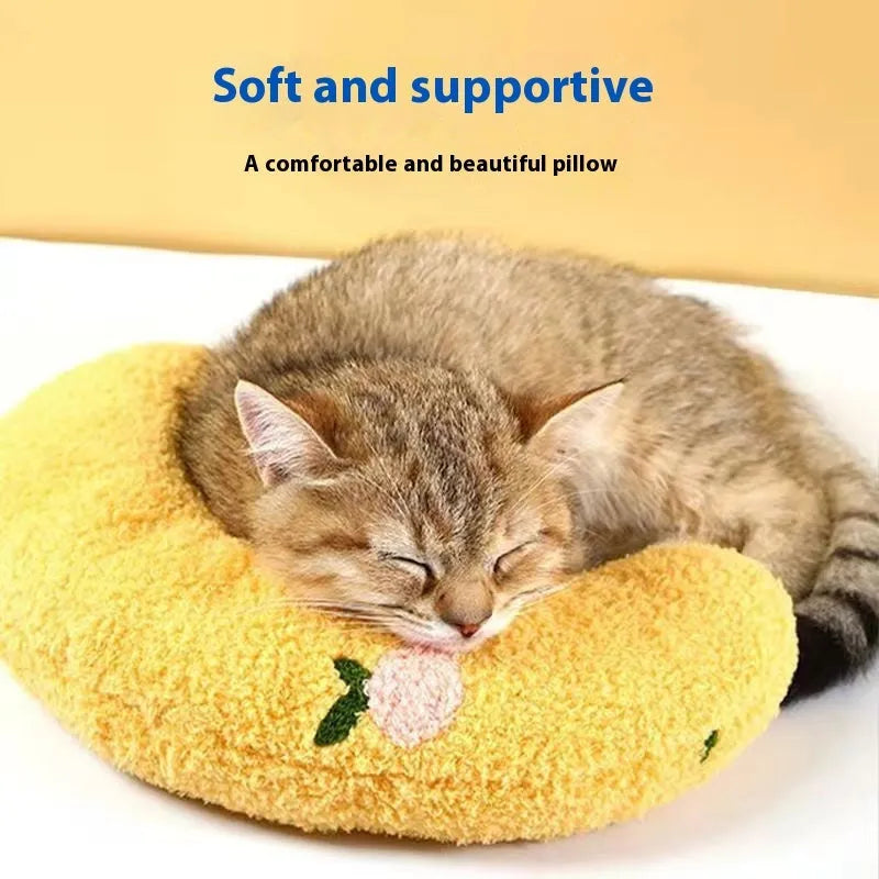 Blue and yellow U-shaped cat neck protection pillows in moon and question mark styles on a white background.