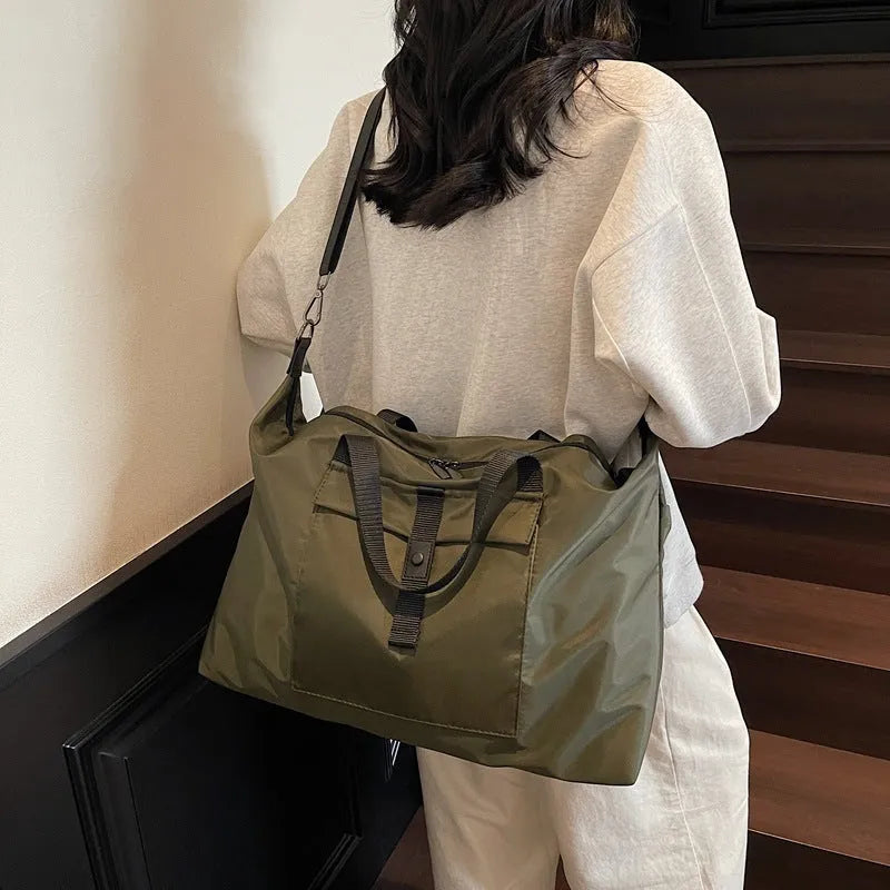 Large capacity one-shoulder travel backpack in Oxford cloth available in black, grey or green