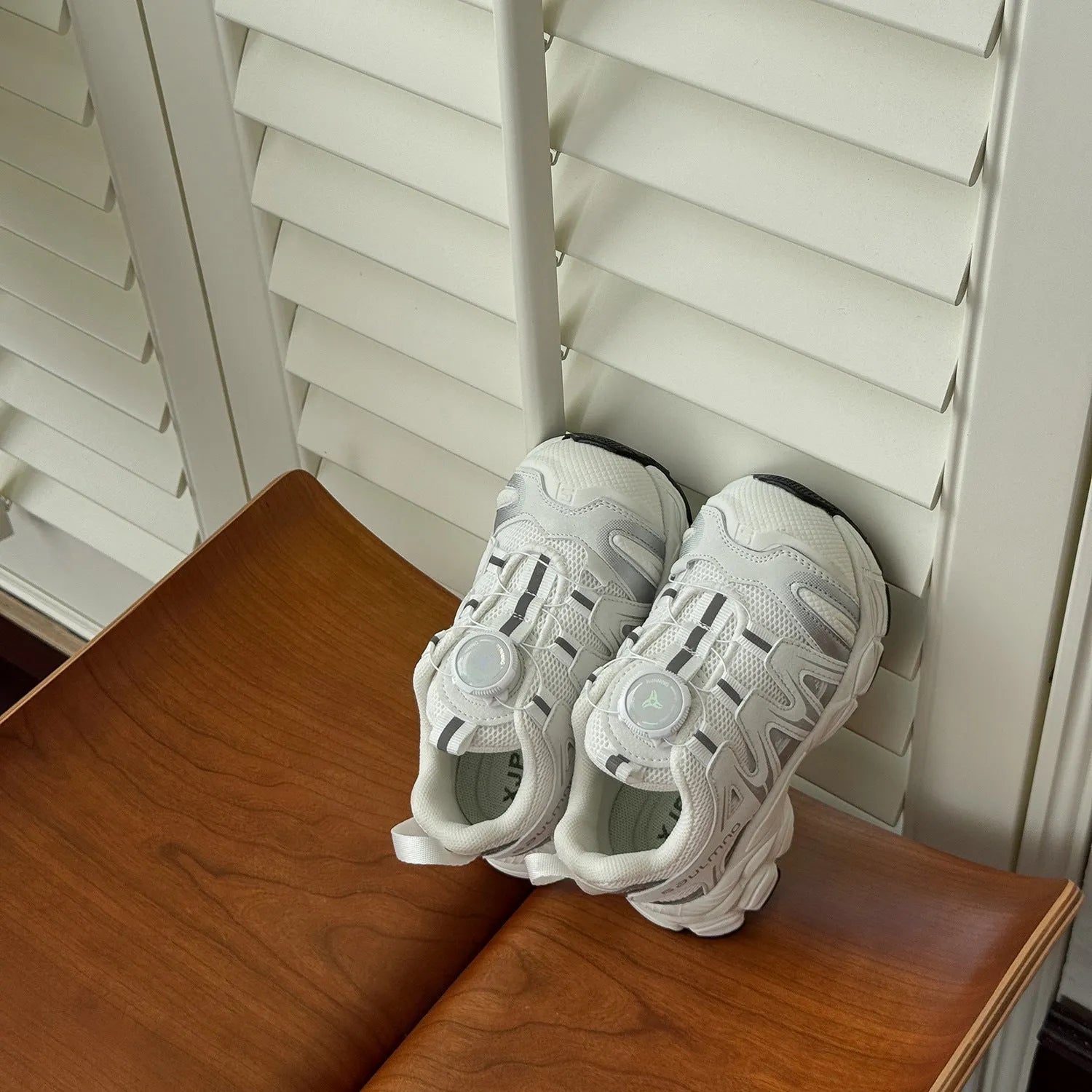 PU leather mesh casual trainers in black, beige, or pink on a white background.