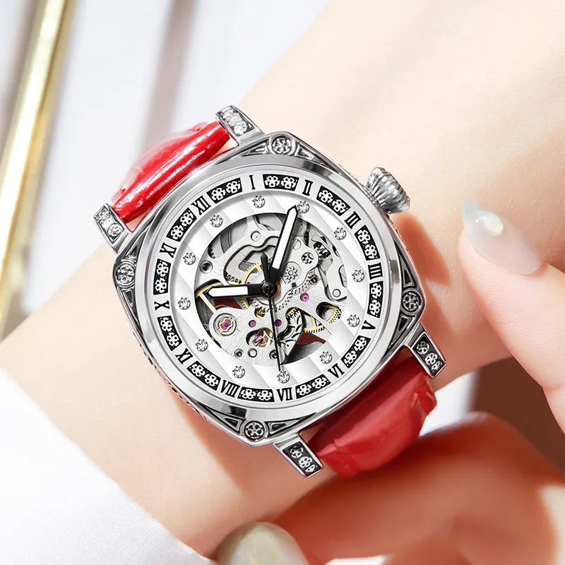 Mechanical wristwatch with luminous hands and a leather strap, shown in a choice of colours.