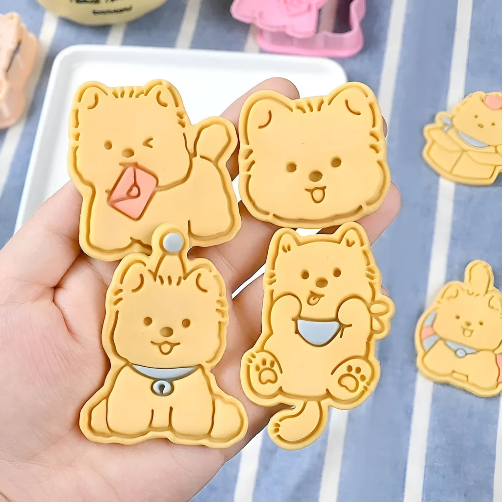 Plastic biscuit mould with puppy head designs including birthday hats and swimming rings