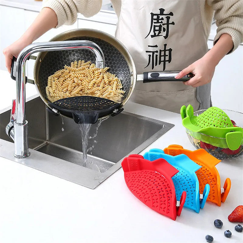 Silicone pot drain stopper kitchen gadget in five colour options on kitchen counter