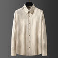 Coffee coloured striped men's long-sleeved business shirt with slim fit on a plus-size model