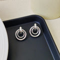 Geometric round ring earrings for women with electroplated gold or silver finishes and irregular contemporary design