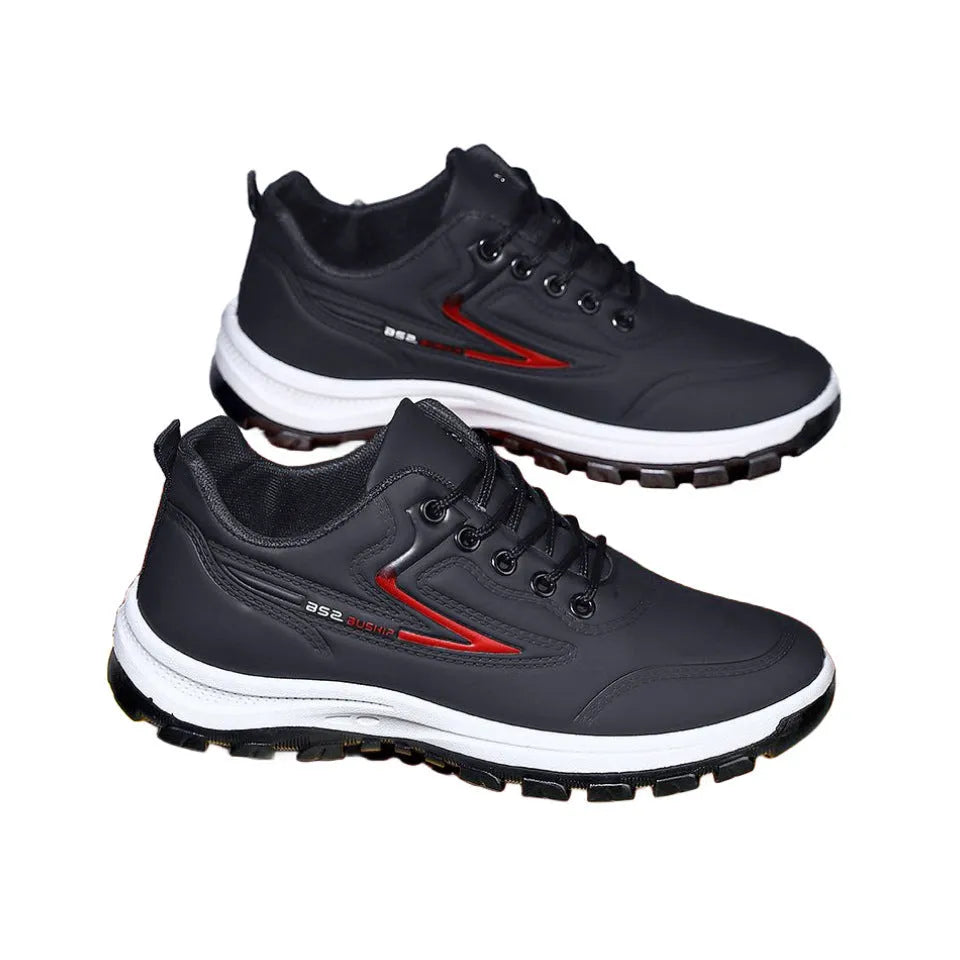 Black and grey waterproof leisure sports shoes with artificial PU upper and lace-up closure on a flat heel.
