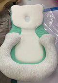 Portable baby flat sleep pillow with soft cotton surface in multiple colour options on a neutral background.
