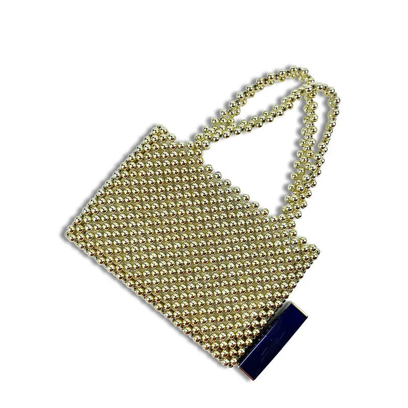 Gold hand-woven metal beads steamed crystal pearl bag, square vertical shape with double shoulder straps on a lady
