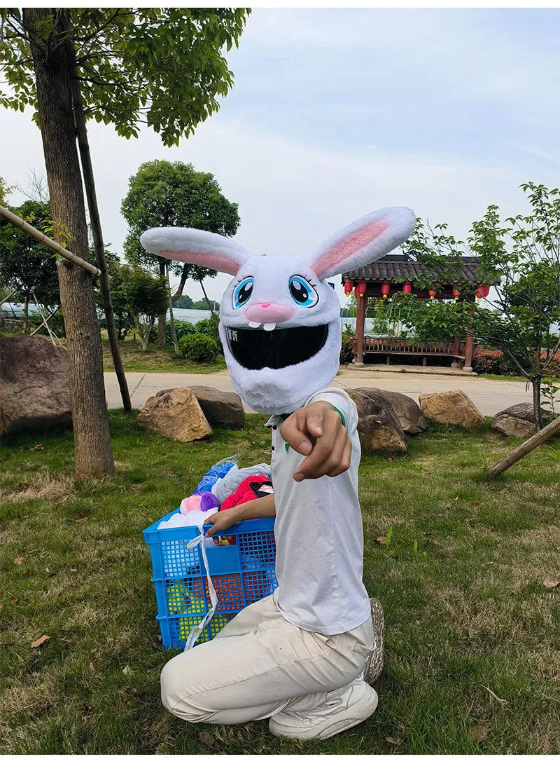 White decorative rabbit head cover for an electric motorcycle helmet with long ears and plush lining.