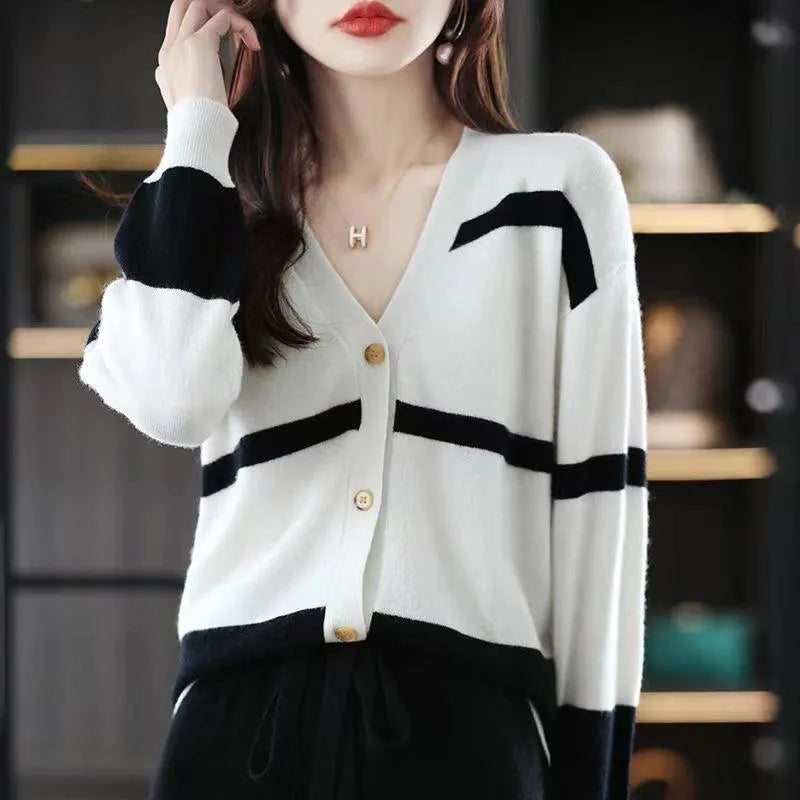 Women's slim fit striped V-neck knitted cardigan in a 3D pattern on a hanger.