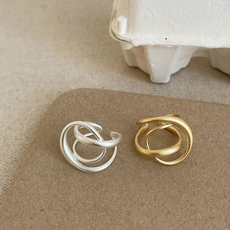 Three-dimensional interlaced matte metal open ring with geometric design in gold or silver electroplated finish