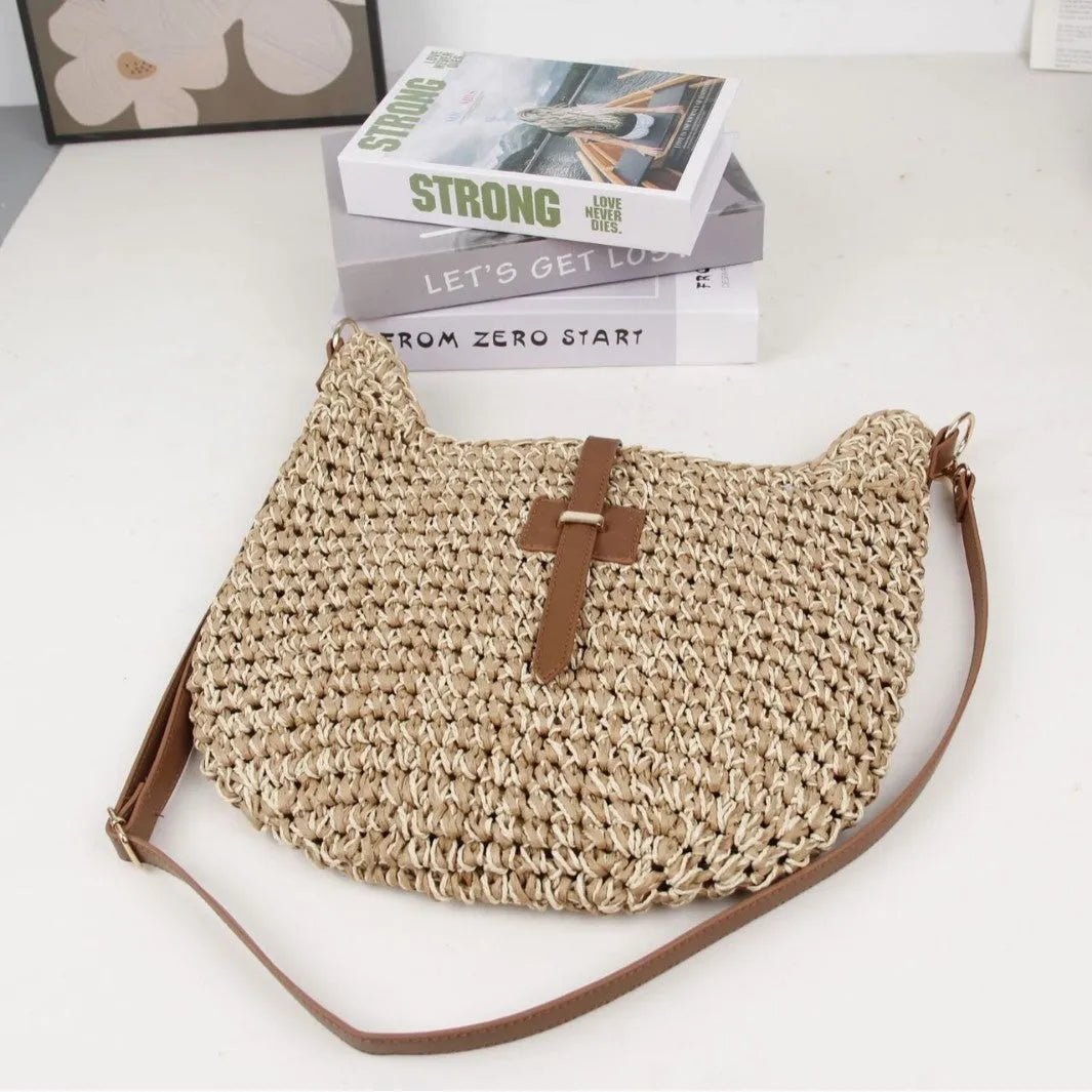 Beige handmade woven crossbody bag with a sandwich pocket and adjustable shoulder strap.