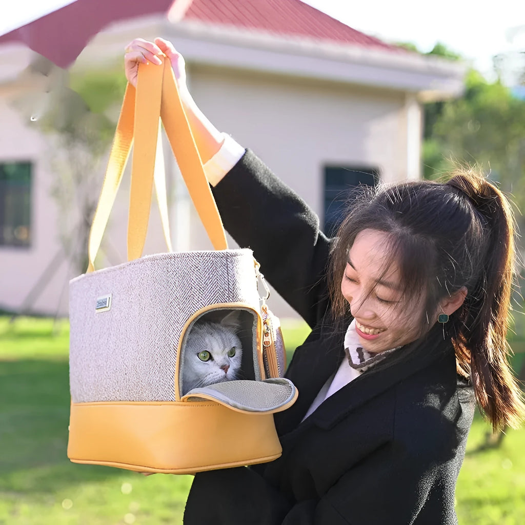 Portable pet carrier backpack with a clear bubble window, shown in a beige and brown colour option.