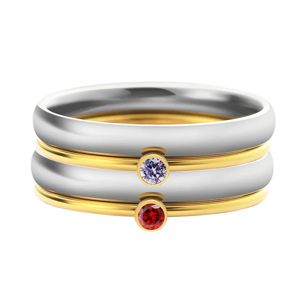 Geometric titanium steel ring with engraved December birthstone design on a white background.