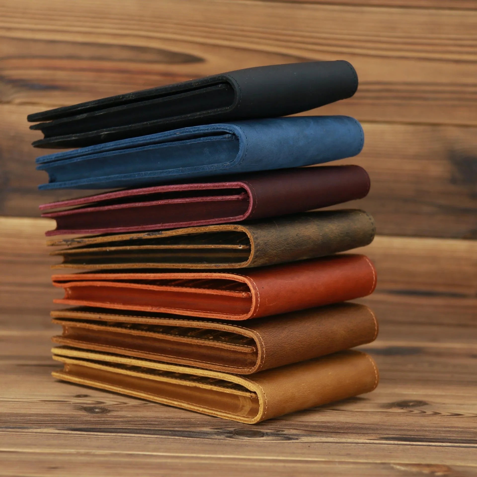 Men's long leather wallet open showing 18 card slots, cash compartment, and phone pocket.