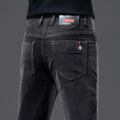 Men's thick corduroy straight trousers with belt in dark grey, shown folded on a neutral background.