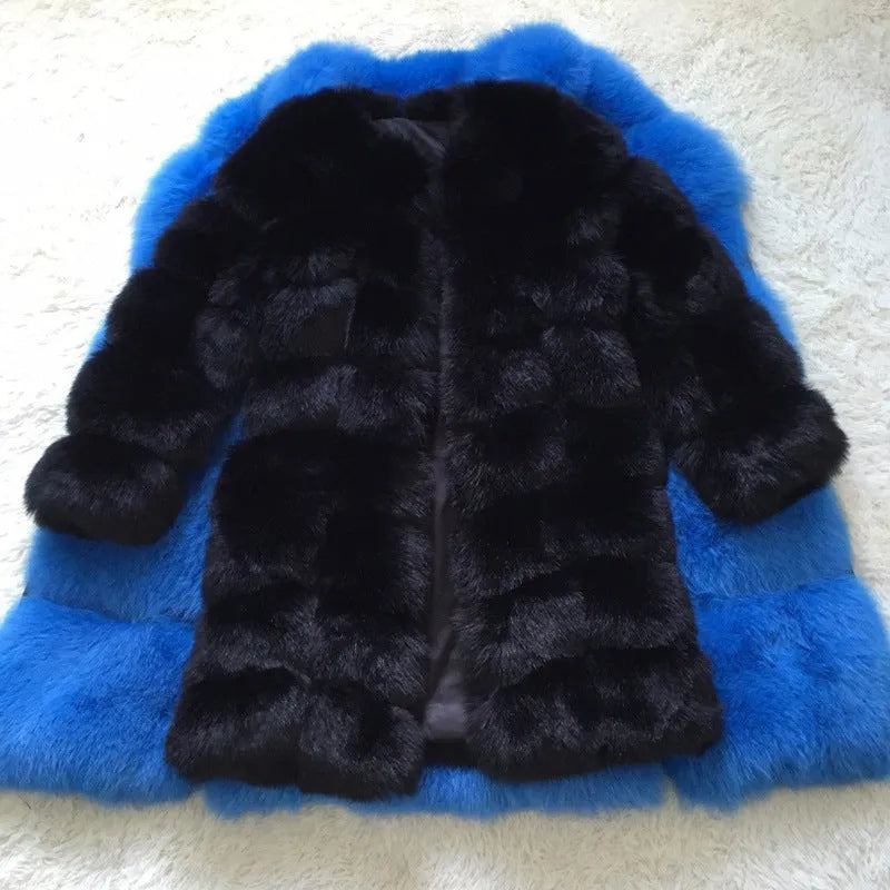 Women's long black artificial fur coat with regular sleeves on a hanger.