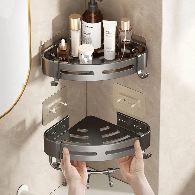 Gun grey triangular corner bathroom storage rack mounted on wall with toiletries