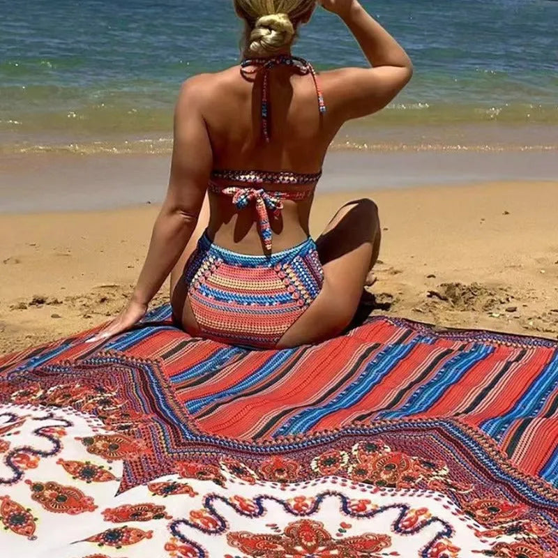 Women's three-piece swimsuit set showing high-waisted bikini bottom, cutout blouse, and matching cover-up coat in a printed design.