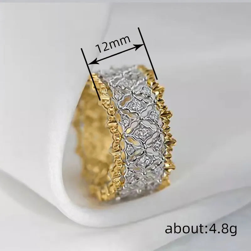 Geometric copper zircon ring with a two-tone gold and silver electroplated finish and a round stone.