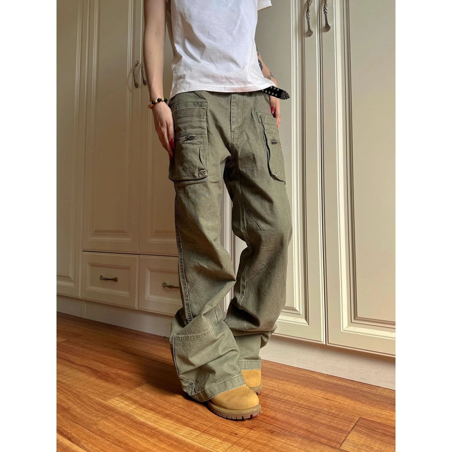 Green double zip cotton casual workwear trousers with a pocket, shown in a mid-waist fit.