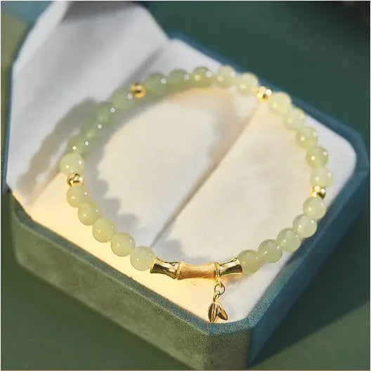 Retro bamboo design bracelet with flower shape and Ruyi elements in coloured glaze construction