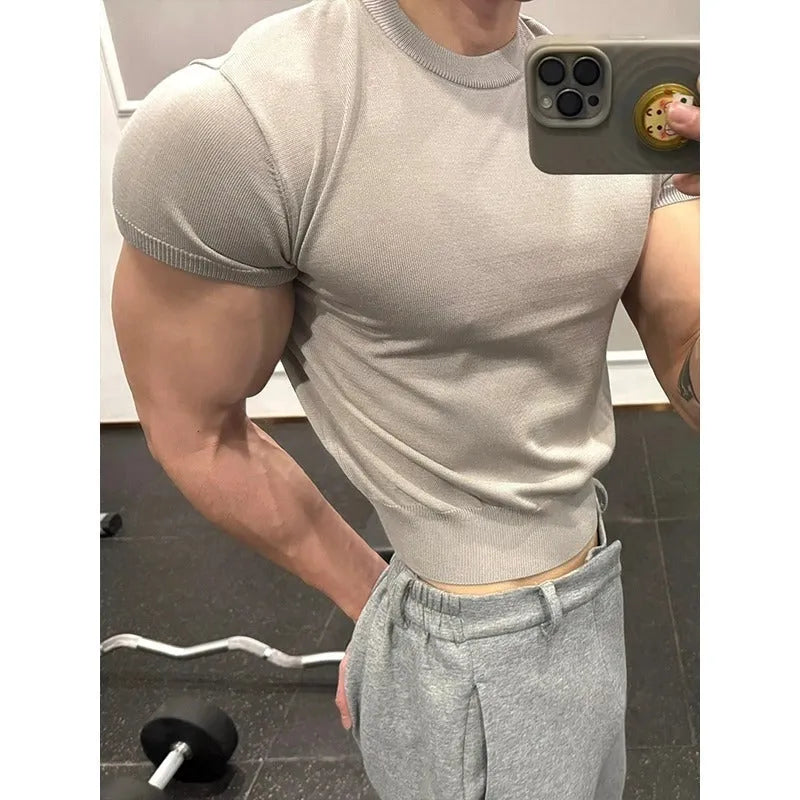 Men's slim fit short sleeve polyester T-shirt showing cuff-closing thread detail in solid colour option.
