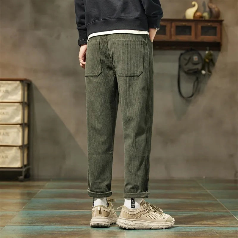 Men's corduroy casual trousers in tapered straight-leg style with mid waist and zipper fly closure
