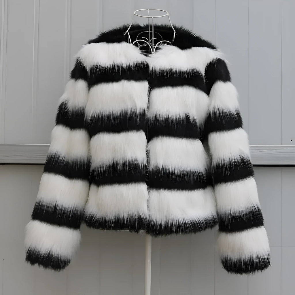 Women's black and white striped faux fur leather jacket with regular sleeves.