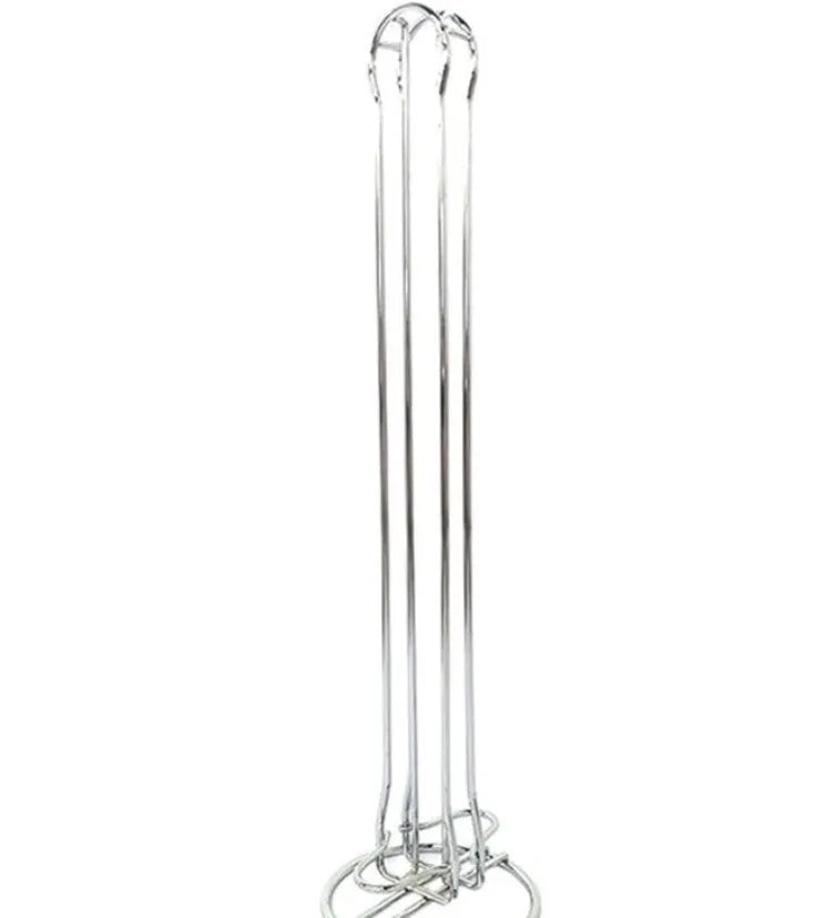 Black wrought iron coffee capsule storage rack holding pods on shelving, modern simple design.