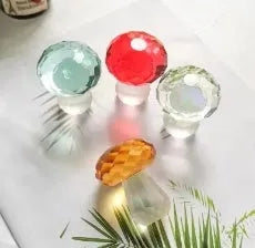 Colourful white crystal mushroom decorative craft in modern geometric style on a desk.