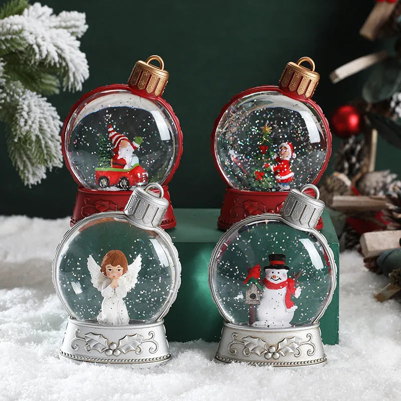 Set of four battery-powered LED Christmas decoration figures including old man, snowman, child tree and angel