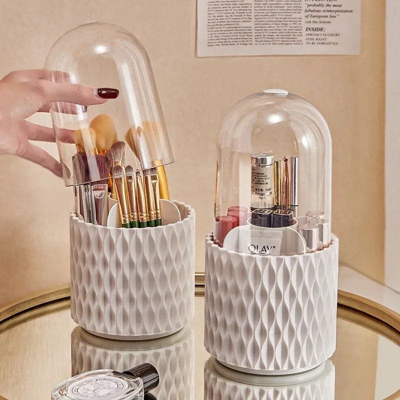 White rotating makeup brush storage holder with transparent lid on desktop