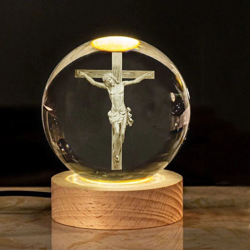 6cm white crystal ball ornament with engraved cross on a solid wood warm light base.