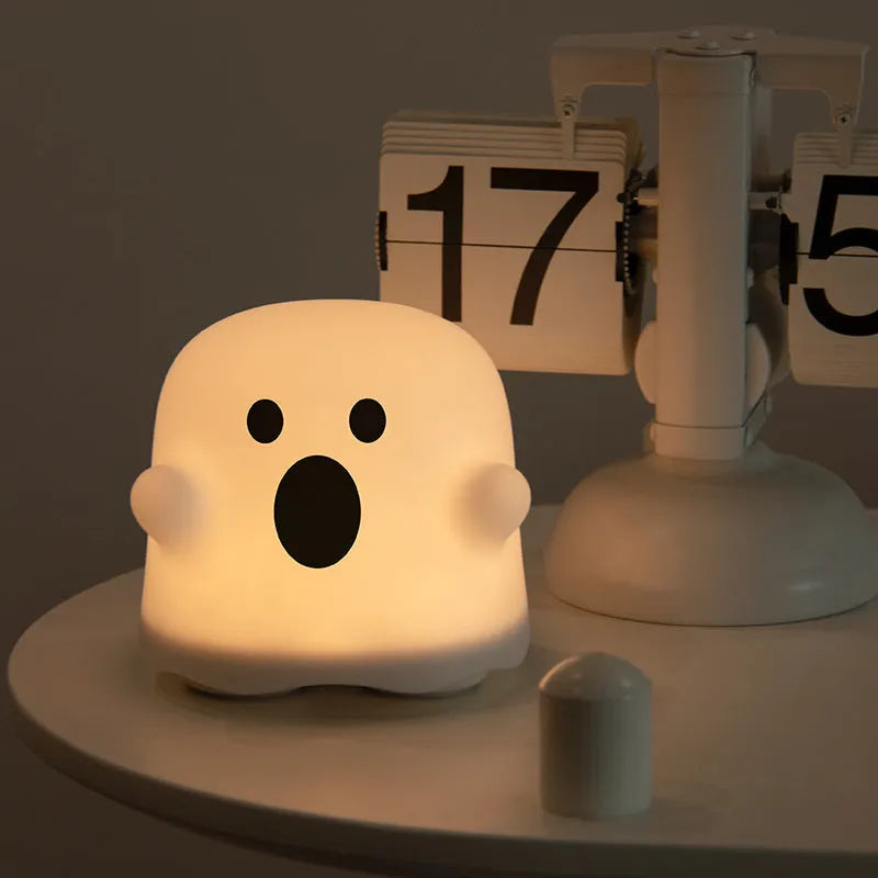 White silicone LED night light with touch sensor base and portable handheld design
