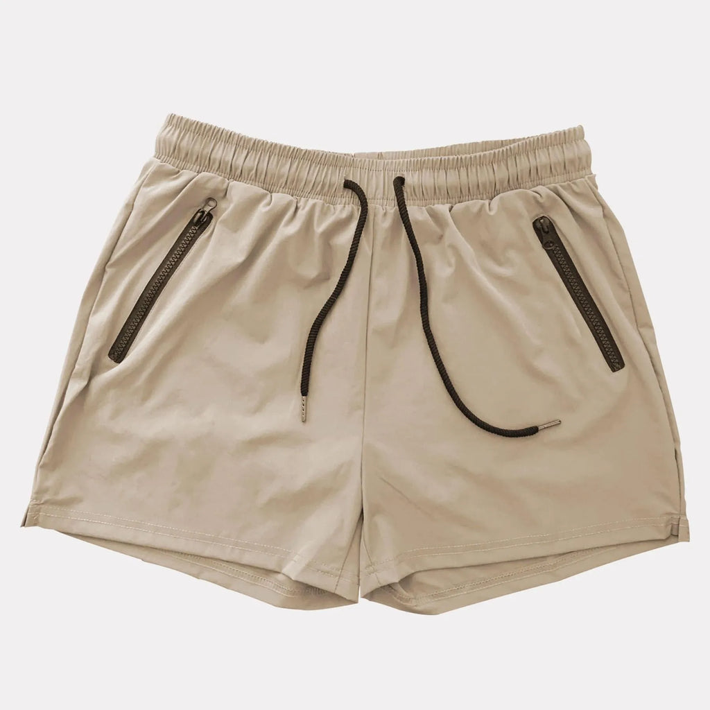 Man wearing blue mid-waist polyester sports shorts on a casual summer day.