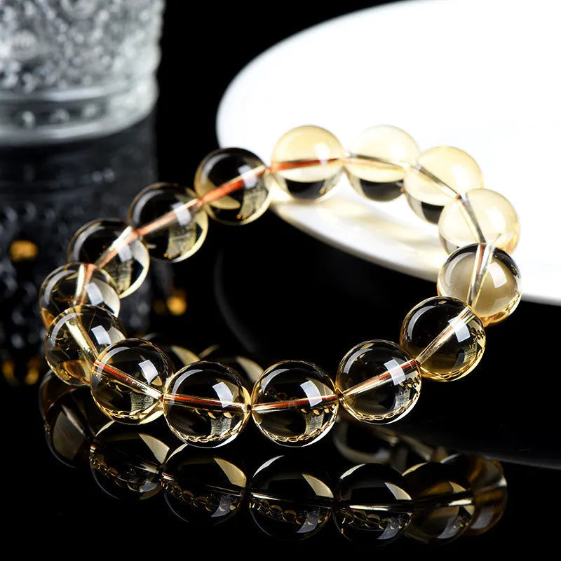 Natural citrine scattered bead bracelet in 7A grade on a wrist, showing polished stones and original design.