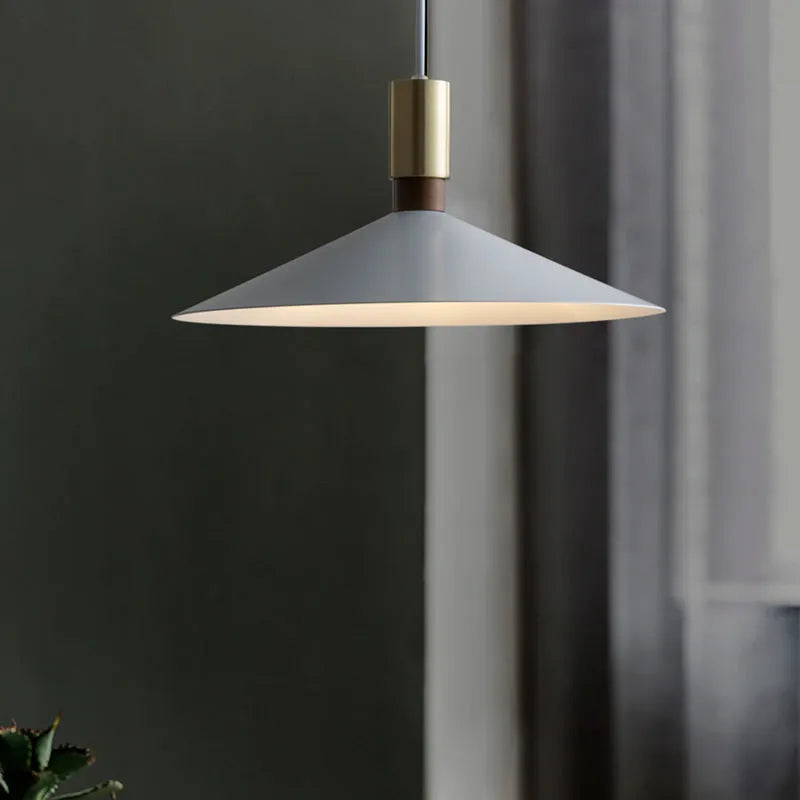 Minimalist single-headed round iron table lamp shown in black, 42cm diameter, hanging above a dining table
