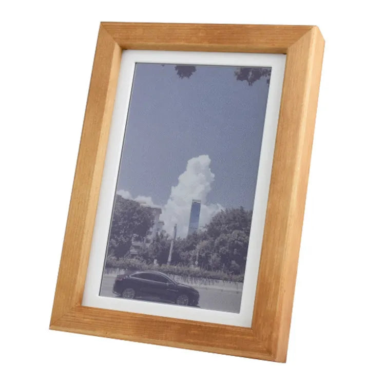 73-inch solid wood digital photo frame with rainbow colour band and e-ink screen showing a photo