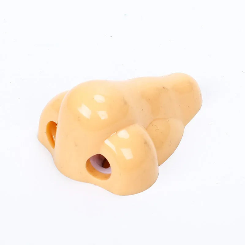 Flesh colour plastic manual pencil sharpener with geometry shape measuring 58x45x30mm