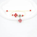 Close-up of a hand-woven glass dried flower bracelet with large colourful beads on a wrist.