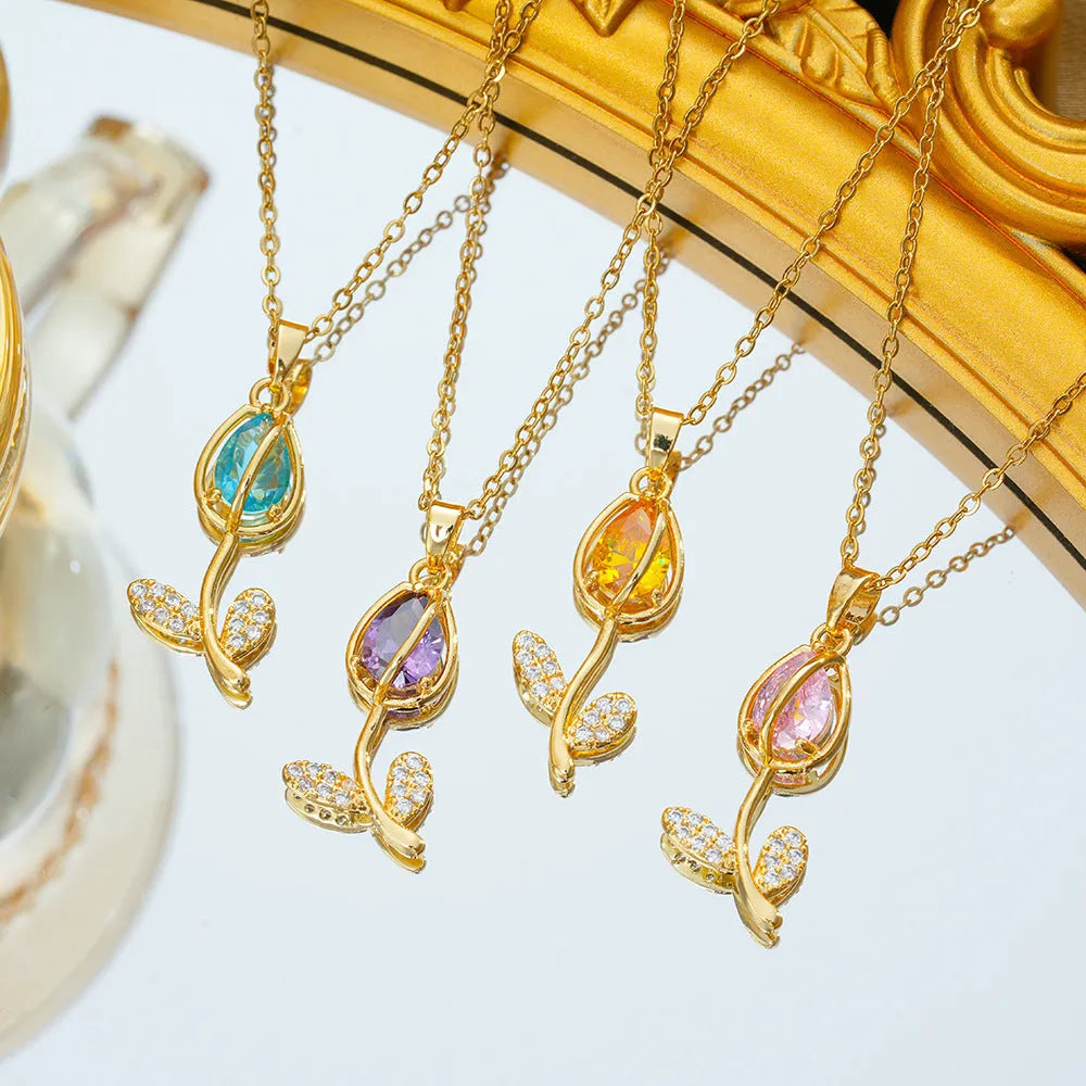 Gold tone zircon tulip pendant necklace on a model, showing the adjustable O-ring chain.