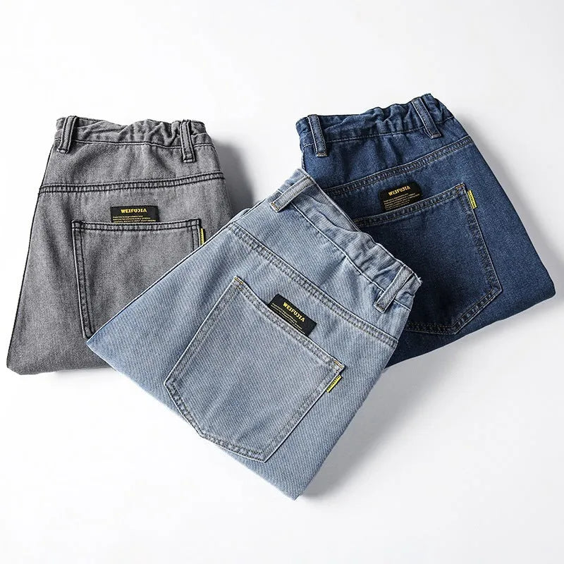 Men's loose straight cotton jeans in dark blue colour showing mid waist and zipper fly design