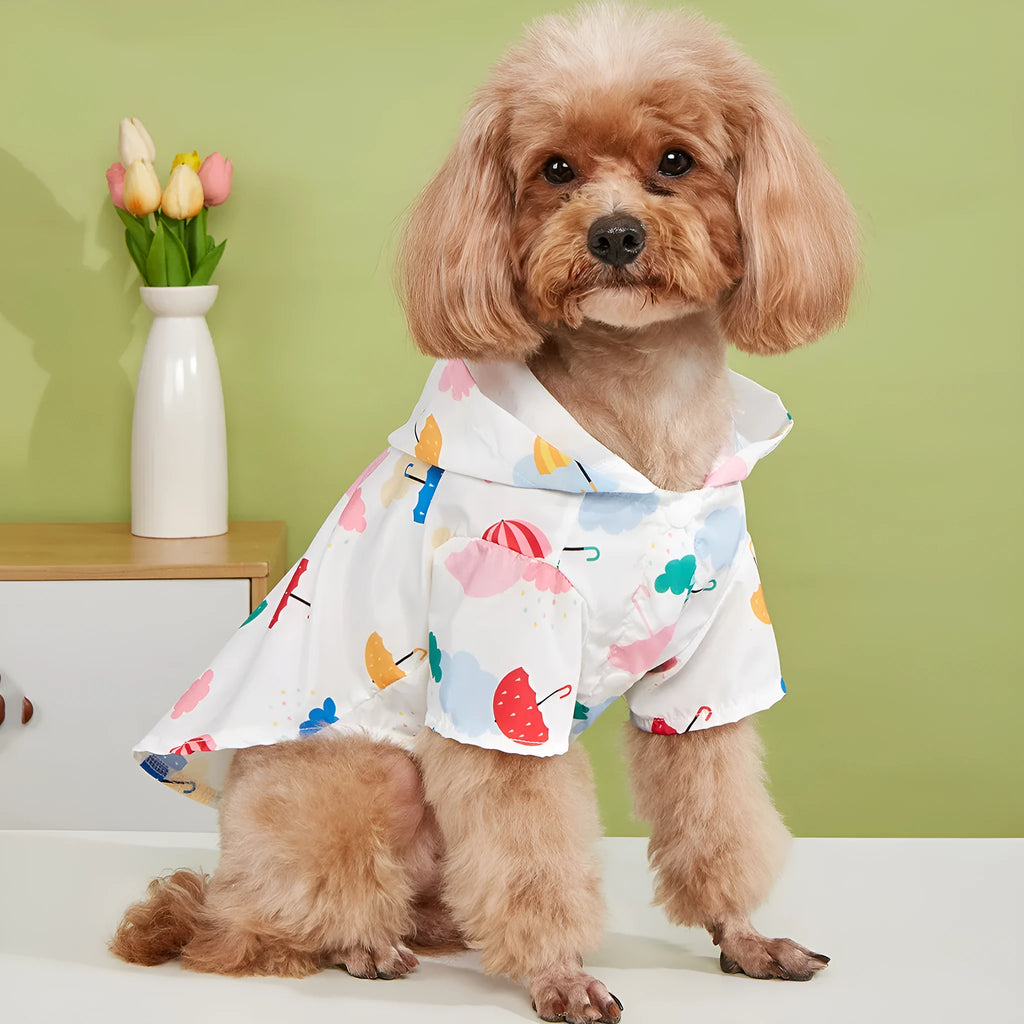 Colourful cartoon umbrella patterned dog or cat raincoat made from polyester fabric.