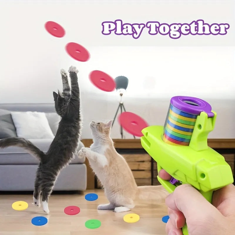 Interactive cat toy launcher with foam discs in green or purple durable plastic