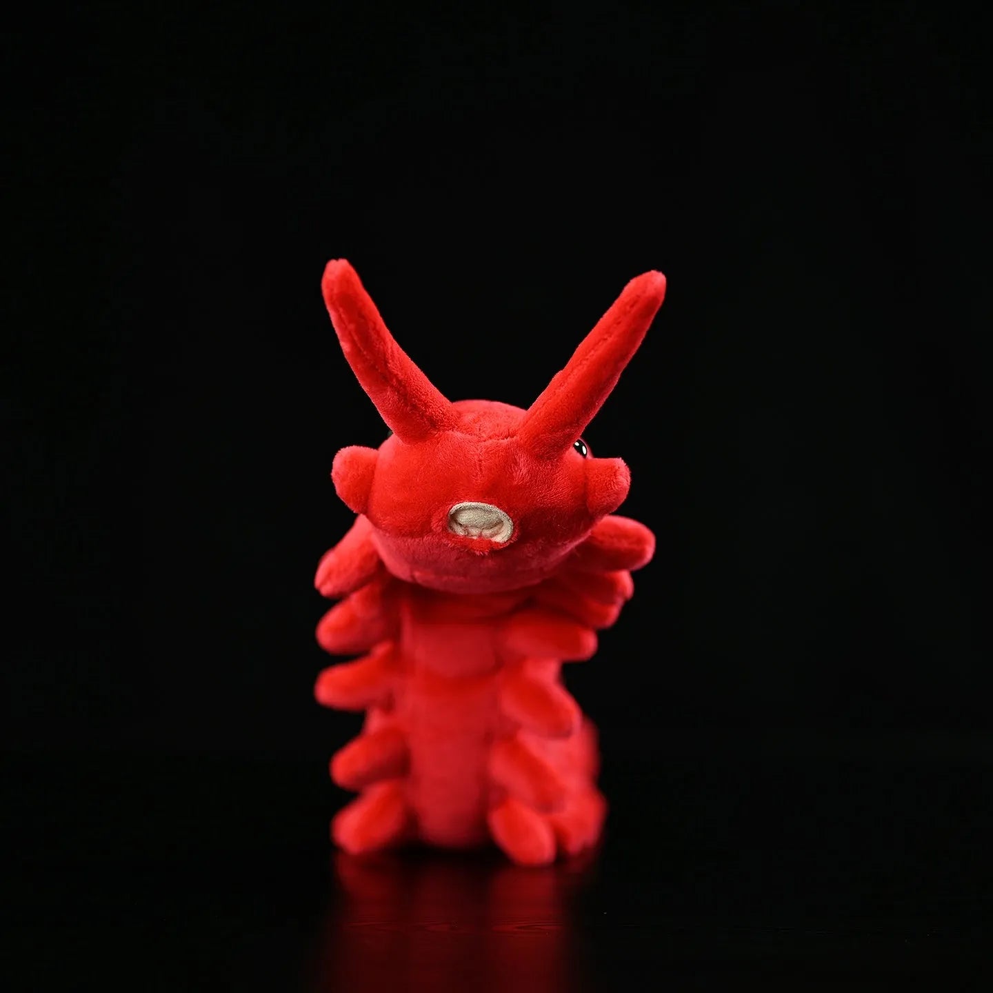 Red velvet worm plush toy silkworm doll 60cm long on a plain background