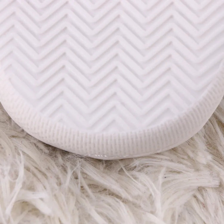 White cartoon fluffy slippers with toe holder design and non-slip rubber soles