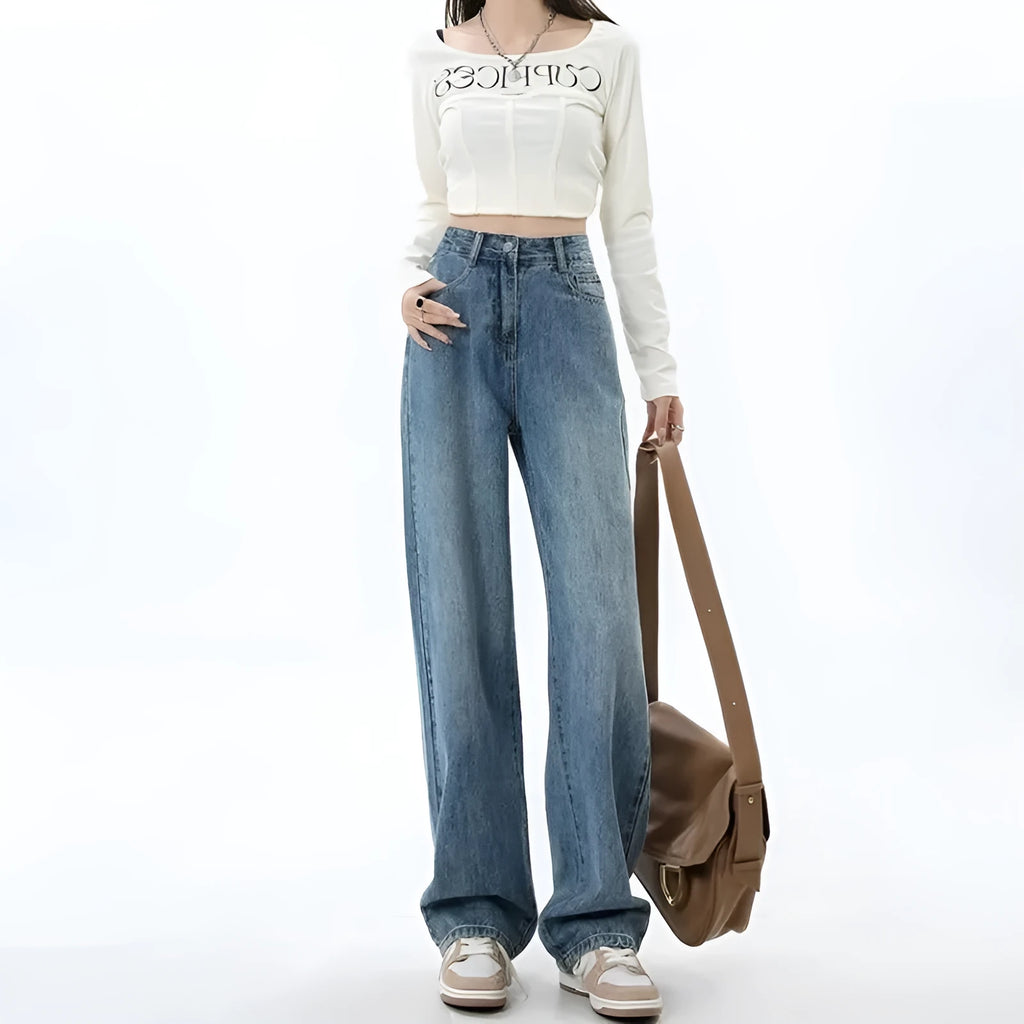Retro blue high-waist wide leg jeans on a hanger showing straight leg trouser cut.