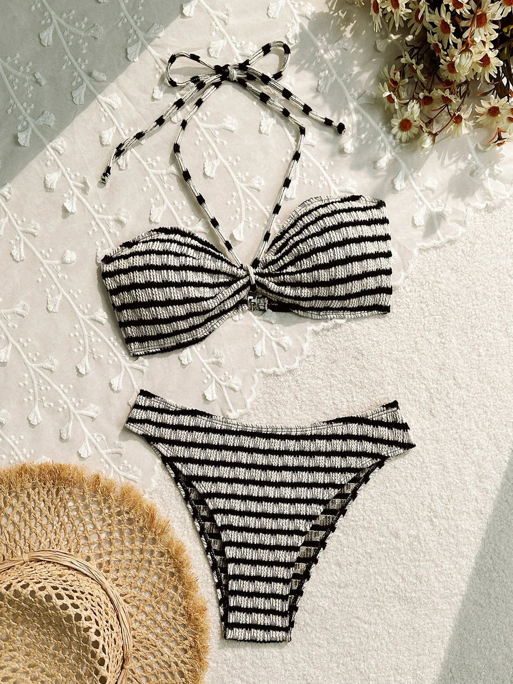 Pink and black striped women's bikini swimsuit with split design and matching briefs