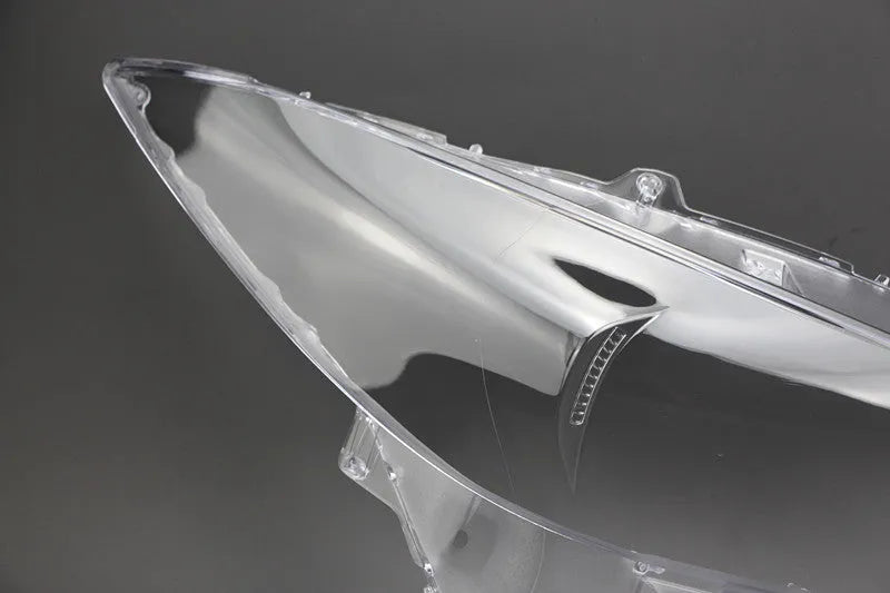 Mazda 3 Exela replacement headlamp cover with tube of snake glue adhesive.