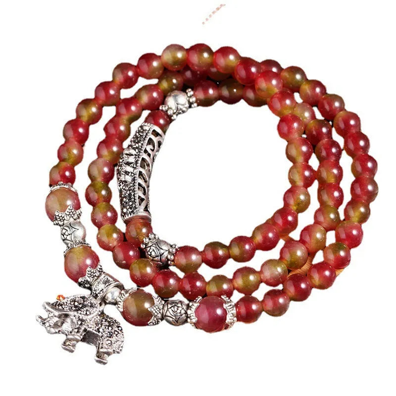 Watermelon crystal Chinese knot bracelet showing traditional design and natural crystal material